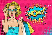 Wow Female Face. Sexy Surprised Young Woman In Glasses With Open Mouth And Blonde Curly Hair Holding Shopping Bags And Wow! Speech Bubble. Vector Bright Background In Pop Art Retro Comic Style. 