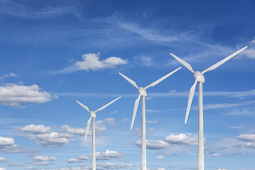 Wind power station against a blue sky.