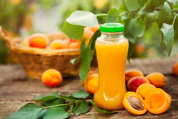 Wall Mural - Bottle with apricot juice and apricots