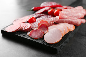 Wall Mural - Delicious sliced sausages on wooden board