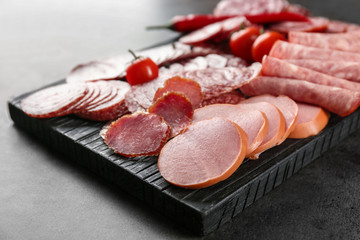 Wall Mural - Delicious sliced sausages on wooden board