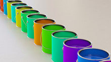 Long Isolated Line Of Brightly Colored Paint Cans On A Neutral Surface