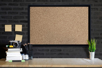 Wall Mural - Desk space concept. Mock up Cork board, vintage camera and films on wood table workplace with supplies.
