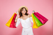 © Drobot Dean - Portrait of a joyful smiling girl holding colorful shopping bags