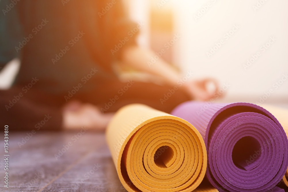 Closeup view of yoga mat and woman on background - obrazy, fototapety, plakaty 