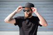 © 4Max - Hipster handsome male model with beard  wearing black blank  baseball cap  with space for your logo