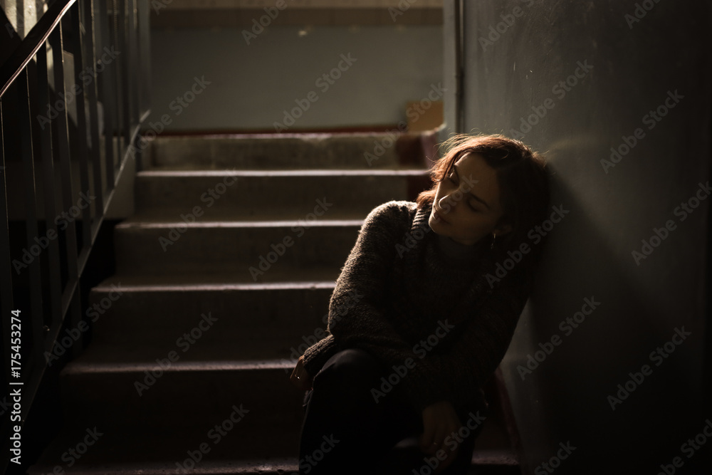 woman in  sweater at the steps, dark style - obrazy, fototapety, plakaty 