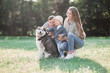 © Dziana - sunny pictures of a happy married couple with a dog and a child