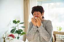 Sick Mature Woman Catch Cold. Sneezing With Handkerchief, Coughing, Got Flu, Having Runny Nose.
