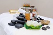 © Evgeniy Kalinovskiy - stones for massage , massage oil and a flower in Spa salon