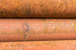 point leake on rusty metal tubes and pipes for construction and industrial use laying on heap
