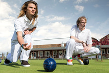 Two Young Men Lawn Bowling On Bowling Green