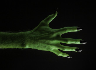 Halloween green witches or zombie monster hand