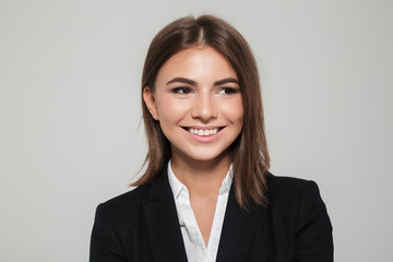 Canvas Print - Close up portrait of a woman in suit looking away