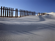 Sand Dune Against Fences