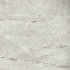 Recycled grey creased and stained paper texture background