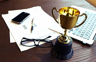 Wall Mural - trophy on work table, win concept