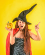 © Volodymyr - Halloween woman with long red hair in witch hat