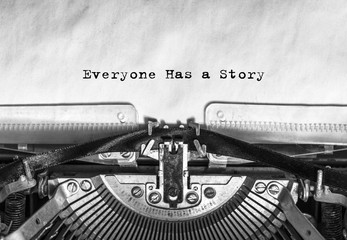 Wall Mural - Everyone Has a Story typed words on a vintage typewriter