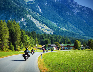 Wall Mural - Motorcyclists on mountainous road