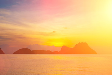Wall Mural - bright colors at dawn on the beach at sunrise in the gulf of thailand.