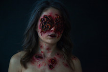 Girl With Realistic Sores And Worms In Her Eyes. Creative Halloween Makeup.