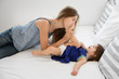 © Lisa Tichané - Mother kissing baby girl foot