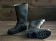 © canonmark2 - Men's rubber boots on the wooden floor