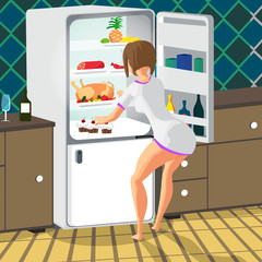 Young woman takes out food from the refrigerator in the kitchen 