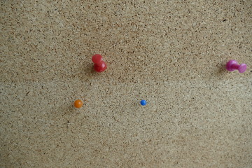 colored pin in an office pinboard