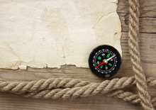 Vintage Paper With Compass And Rope On Old Wooden Boards
