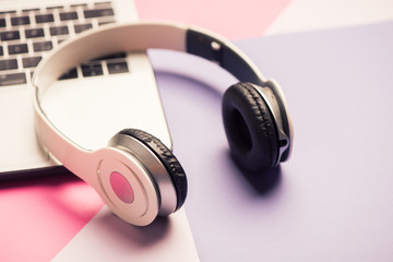 headphones and laptop computer closeup. online music concept.