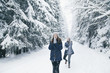 © Borislav Zhuykov/Stocksy - Female couple enjoying snowball fight