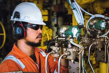 Wall Mural - Technician,Instrument technician on the job calibrate or function check pneumatic control valve in process oil and gas platform offshore,technician