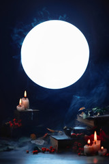 Wall Mural - Magical books and candles in a dark still life with full moon. Halloween concept with smoke. Spooky mood.