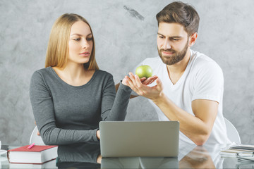 Poster - White couple at desk with laptop