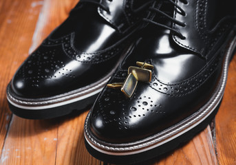 Wedding man's accessories. Black shoes with cuff