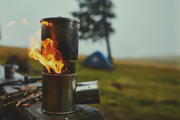 Cooking in a pot over the firewood stove