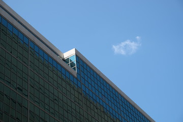 Low Angle View of Modern Building Facade Against Clear Blue Sky