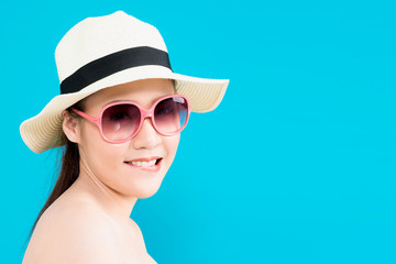 Wall Mural - Young Asian woman flirting isolated on blue background.