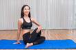 © Sasils Production - Beautiful young fit asian woman doing yoga.
