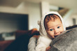 © Jacob Lund - Cute little baby on his mother's chest