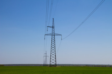 High voltage power line against blue sky