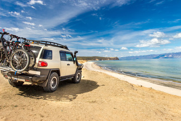 Off-road car on the sea coast