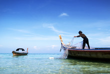 Fidsherman   In White Sand Beach In  Andaman Sea