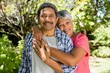 © WavebreakMediaMicro - Senior couple embracing each other in garden on a sunny day