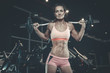 © antondotsenko - Sexy athletic young girl training legs in gym