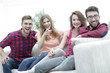 © ASDF - group of happy young people sitting on the couch