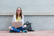 © 4frame group - Happy hipster young woman working on laptop