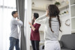 © Shutter2U - The girl puts her hands on her ear because she does not want to hear her parents quarrel.